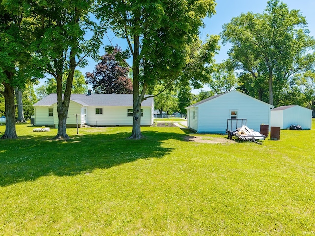 6321 Butt Rd, Fort Wayne, IN 46818 - view of green lawn featuring an outbuilding
