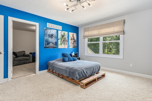 8196 E Walnut Rdg, New Carlisle, IN 46552 - bedroom with a chandelier and carpet