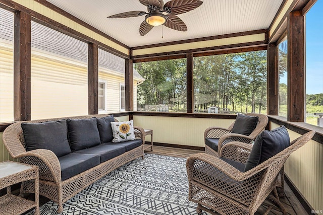 8196 E Walnut Rdg, New Carlisle, IN 46552 - sunroom / solarium with outdoor lounge area, a ceiling fan, wood finished floors, and a wooden deck