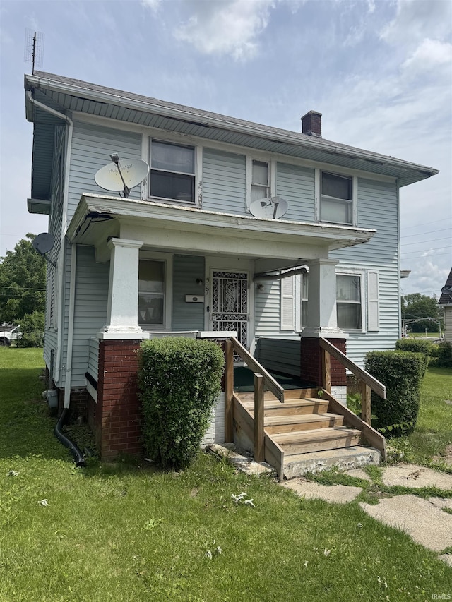 527 E Leith St, Fort Wayne, IN 46806 - view of front facade featuring a front yard and a chimney