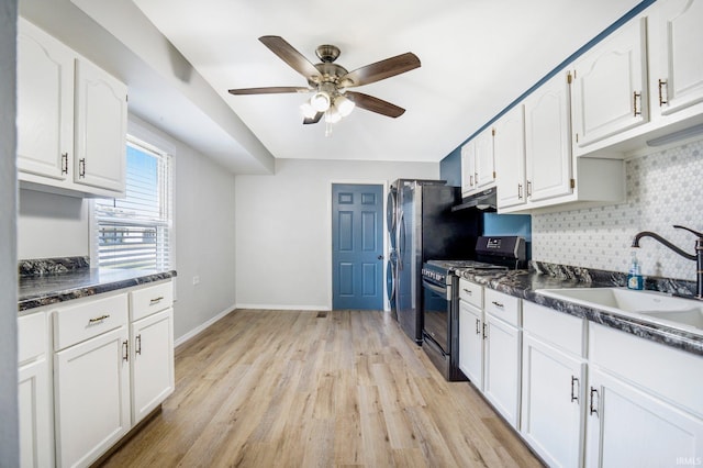 8 Emerald Ln, Huntington, IN 46750 - kitchen featuring appliances with stainless steel finishes, dark countertops, ceiling fan, and white cabinets