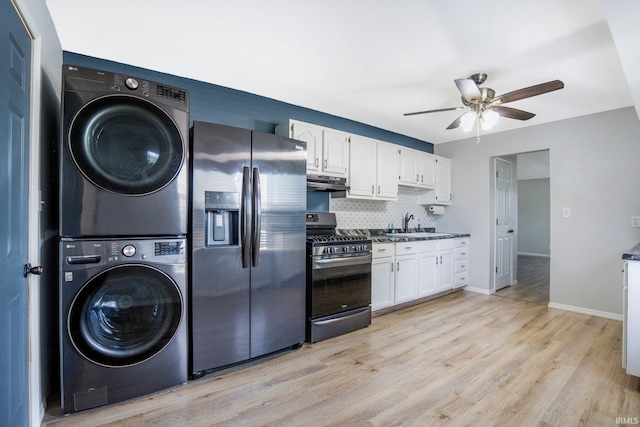8 Emerald Ln, Huntington, IN 46750 - kitchen with stainless steel appliances, stacked washer / drying machine, ventilation hood, white cabinets, and backsplash
