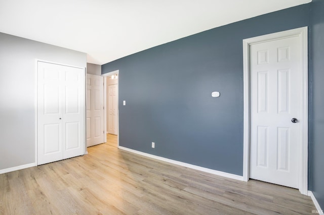 8 Emerald Ln, Huntington, IN 46750 - unfurnished bedroom featuring light wood-type flooring and a closet