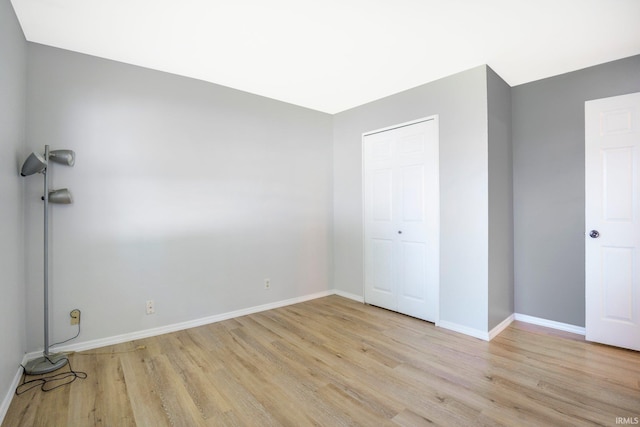 8 Emerald Ln, Huntington, IN 46750 - unfurnished bedroom with light wood finished floors and a closet