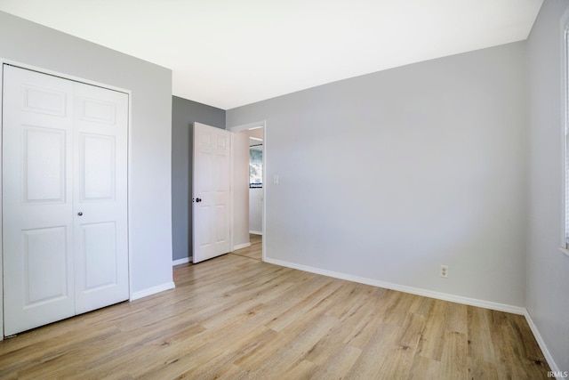 8 Emerald Ln, Huntington, IN 46750 - unfurnished bedroom featuring light wood finished floors and a closet
