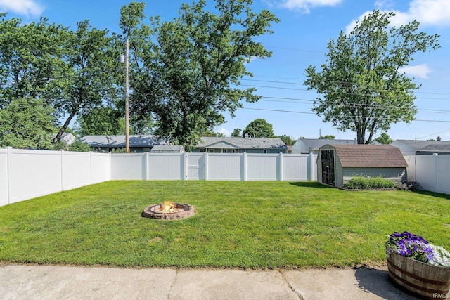 8 Emerald Ln, Huntington, IN 46750 - fenced backyard with a storage unit and a fire pit