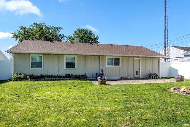 8 Emerald Ln, Huntington, IN 46750 - rear view of property featuring a fire pit, a patio, and a shingled roof