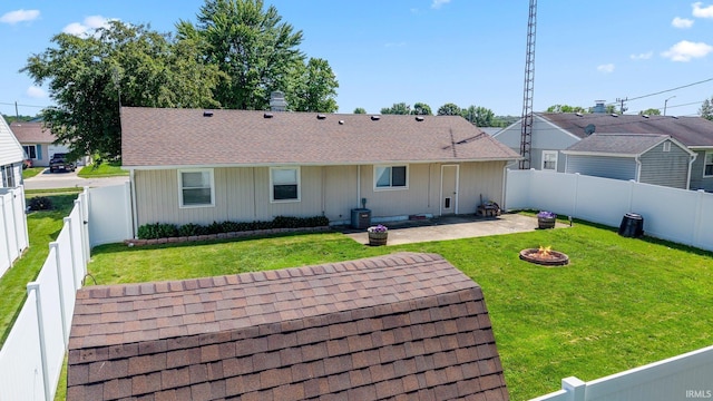 8 Emerald Ln, Huntington, IN 46750 - back of house with a fire pit, a patio, a fenced backyard, and a shingled roof