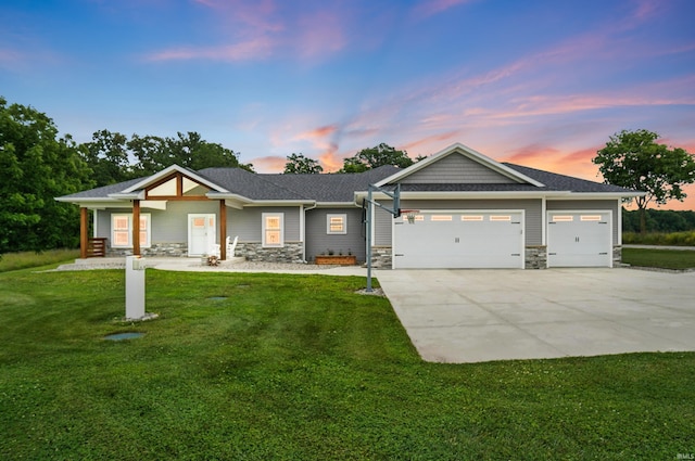 7316 Butt Rd, Fort Wayne, IN 46818 - view of front of property featuring stone siding, a garage, driveway, and a front yard