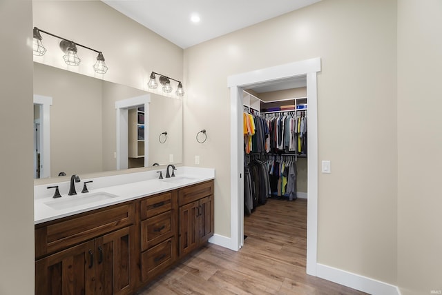 7316 Butt Rd, Fort Wayne, IN 46818 - full bathroom with double vanity, wood finished floors, and a spacious closet