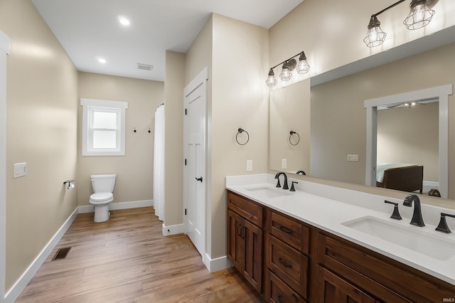 7316 Butt Rd, Fort Wayne, IN 46818 - full bathroom with double vanity, wood finished floors, and recessed lighting