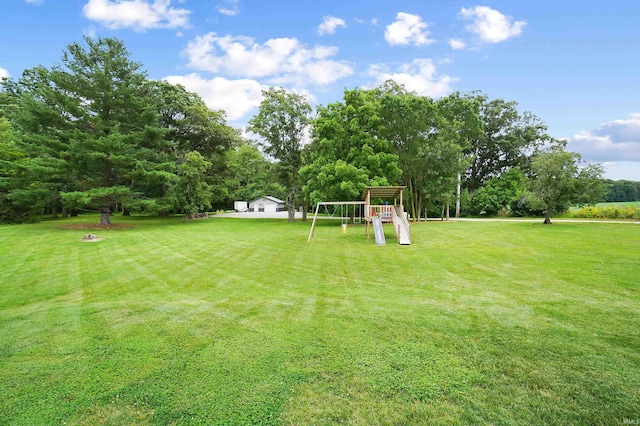 7316 Butt Rd, Fort Wayne, IN 46818 - view of grassy yard featuring a playground and view of scattered trees