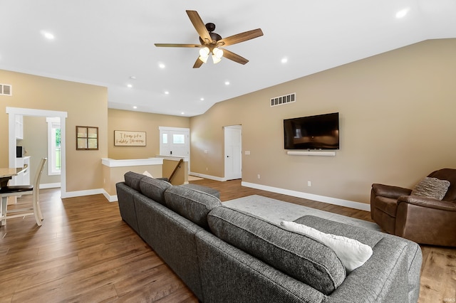 7316 Butt Rd, Fort Wayne, IN 46818 - living area with wood finished floors, ceiling fan, recessed lighting, and lofted ceiling