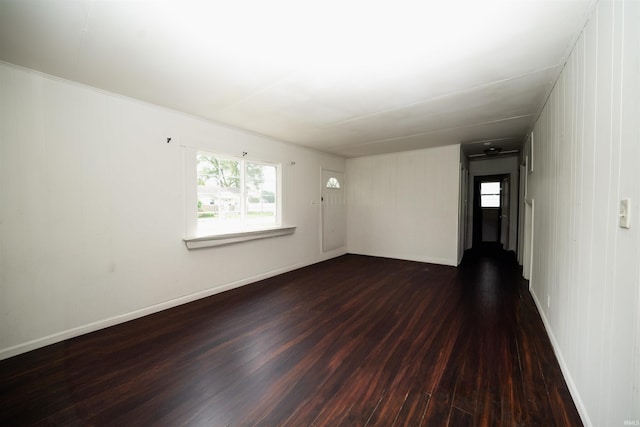 221 S Kenmore St, South Bend, IN 46619 - spare room featuring dark wood finished floors and baseboards