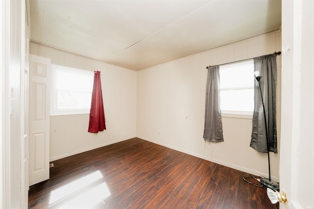 221 S Kenmore St, South Bend, IN 46619 - spare room featuring wood finished floors and healthy amount of natural light