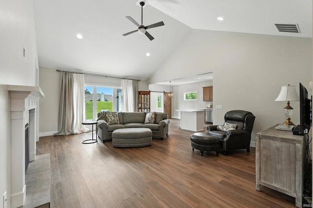 1381 Codorna Cv, Fort Wayne, IN 46804 - living room with ceiling fan, high vaulted ceiling, wood finished floors, a fireplace, and recessed lighting