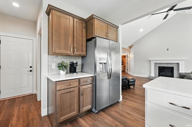 1381 Codorna Cv, Fort Wayne, IN 46804 - kitchen featuring stainless steel fridge with ice dispenser, ceiling fan, open floor plan, dark wood-style floors, and tasteful backsplash