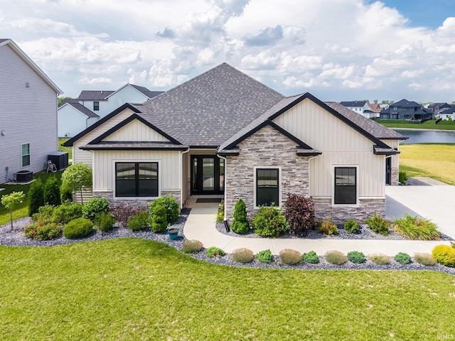 936 Switchfoot Dr, Huntertown, IN 46748 - modern farmhouse style home featuring stone siding, roof with shingles, and board and batten siding