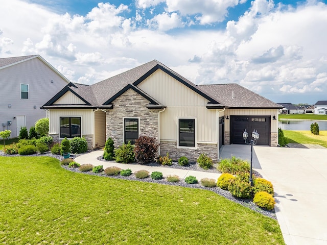 936 Switchfoot Dr, Huntertown, IN 46748 - view of front facade featuring stone siding, concrete driveway, and a shingled roof