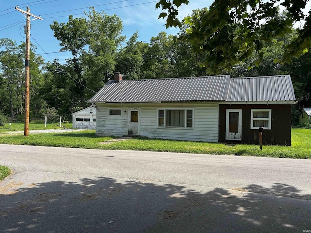 11592 E Main St, Owensburg, IN 47453 - view of front of property with a metal roof, a chimney, and a front yard