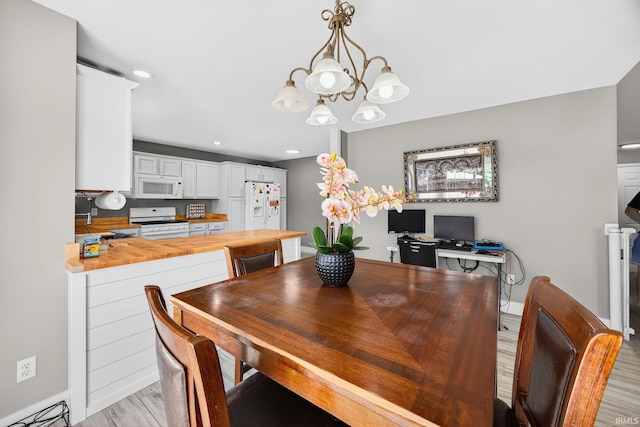 4310 Ashard Dr, South Bend, IN 46628 - dining area featuring a chandelier, light wood-style flooring, and recessed lighting
