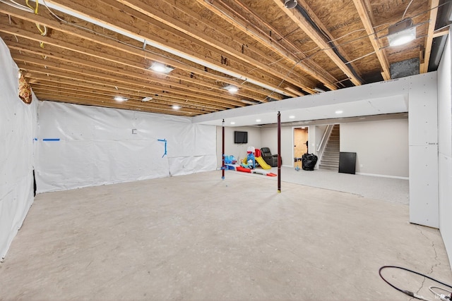 4310 Ashard Dr, South Bend, IN 46628 - basement with stairway and recessed lighting