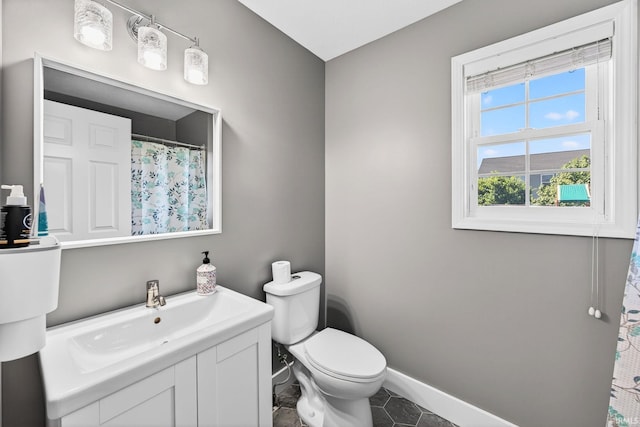4310 Ashard Dr, South Bend, IN 46628 - full bathroom with vanity, tile patterned flooring, and a shower with curtain