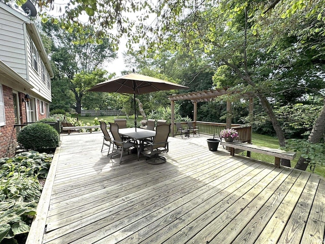 1896 N Michael Dr, Marion, IN 46952 - wooden deck featuring outdoor dining area, a pergola, and view of wooded area