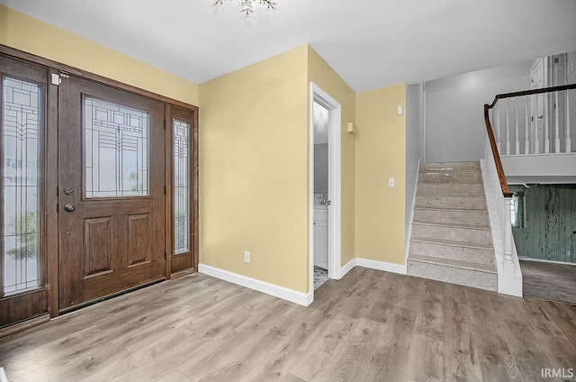 3111 N Eastlake Dr, Elkhart, IN 46514 - foyer with wood finished floors, stairs, and healthy amount of natural light