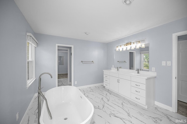 3111 N Eastlake Dr, Elkhart, IN 46514 - bathroom featuring marble finish floors, double vanity, and a freestanding bath