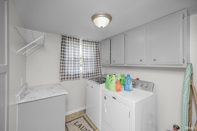 3111 N Eastlake Dr, Elkhart, IN 46514 - laundry area with washing machine and clothes dryer and cabinet space