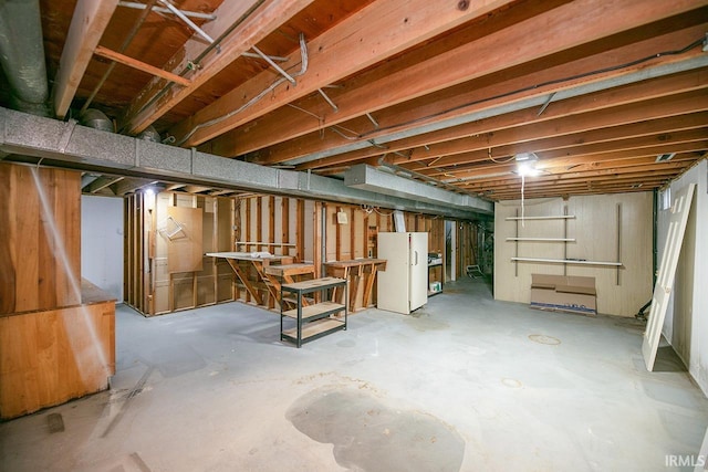 3111 N Eastlake Dr, Elkhart, IN 46514 - unfinished below grade area featuring freestanding refrigerator