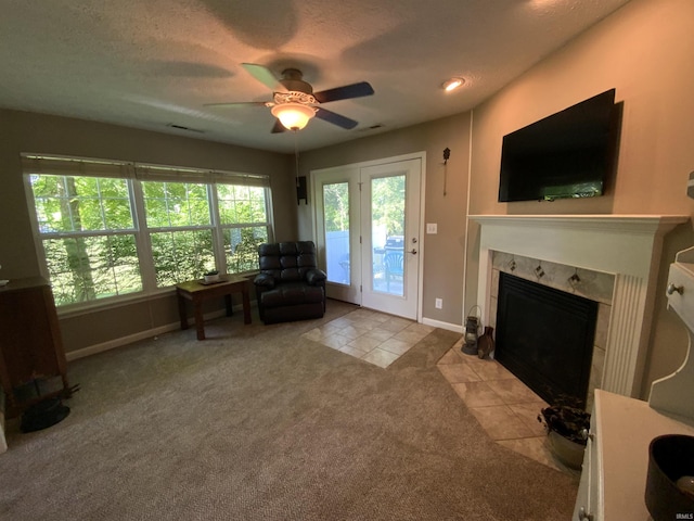 6243 S 700 W, West Point, IN 47992 - carpeted living room with tile patterned flooring, a ceiling fan, and a high end fireplace