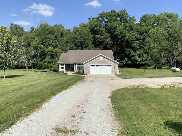 6243 S 700 W, West Point, IN 47992 - view of front of home with driveway, an attached garage, a front yard, stone siding, and a wooded view