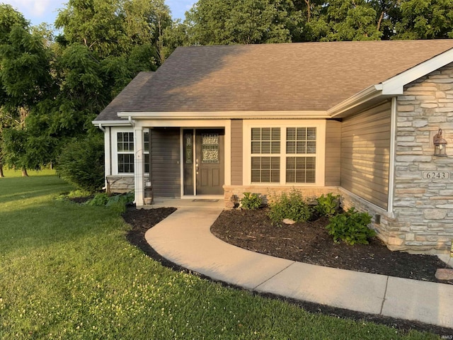 6243 S 700 W, West Point, IN 47992 - entrance to property featuring stone siding, a yard, and roof with shingles