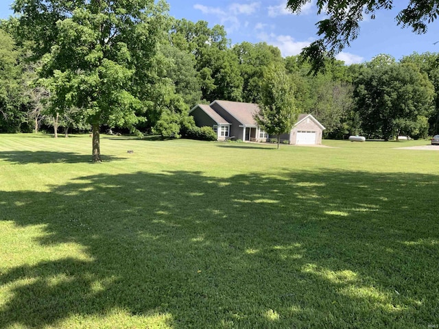 6243 S 700 W, West Point, IN 47992 - view of green lawn featuring a garage