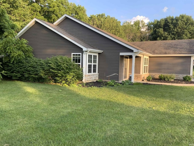 6243 S 700 W, West Point, IN 47992 - view of front of property featuring a front lawn, stone siding, and a shingled roof