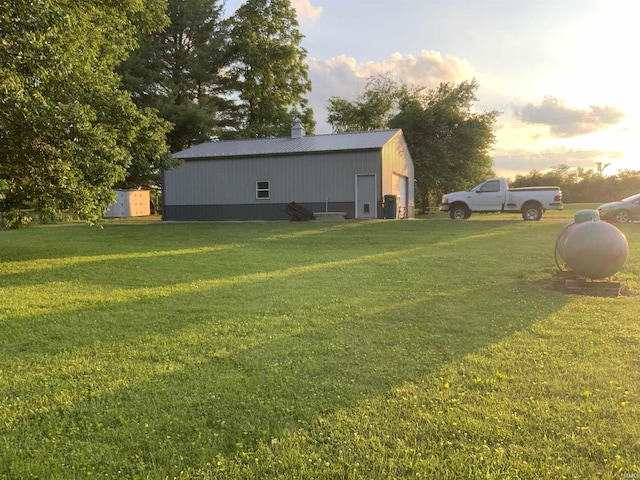 6243 S 700 W, West Point, IN 47992 - yard at dusk with an outbuilding, a yard, and a pole building
