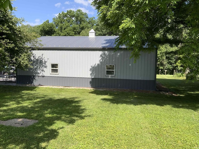 6243 S 700 W, West Point, IN 47992 - view of property exterior featuring a yard, a metal roof, a chimney, and an outbuilding