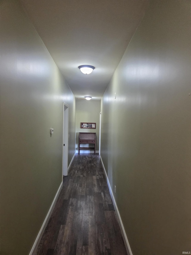 5811W Janssen Ln, Crawfordsville, IN 47933 - hallway featuring dark wood-type flooring and baseboards