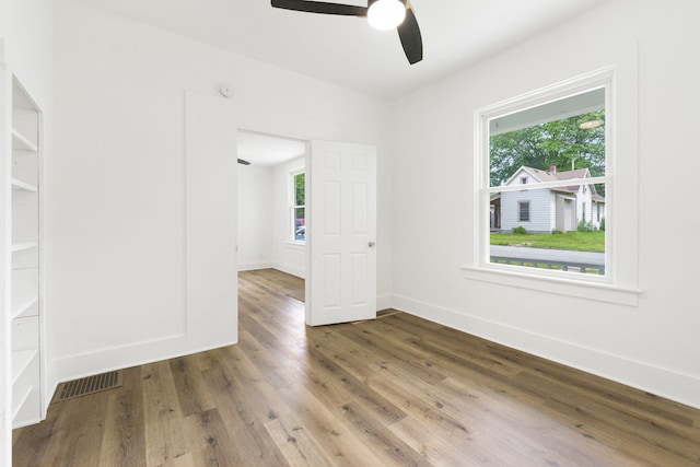 3222 Dinnen Ave, Fort Wayne, IN 46807 - empty room with ceiling fan and wood finished floors