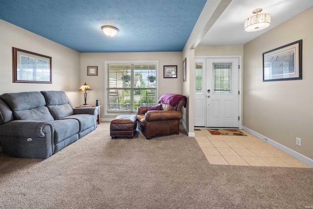 378 Buchanan St, West Lafayette, IN 47906 - living room featuring light colored carpet, light tile patterned floors, and a textured ceiling