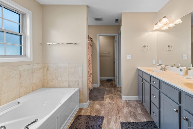 378 Buchanan St, West Lafayette, IN 47906 - full bathroom with double vanity and a garden tub