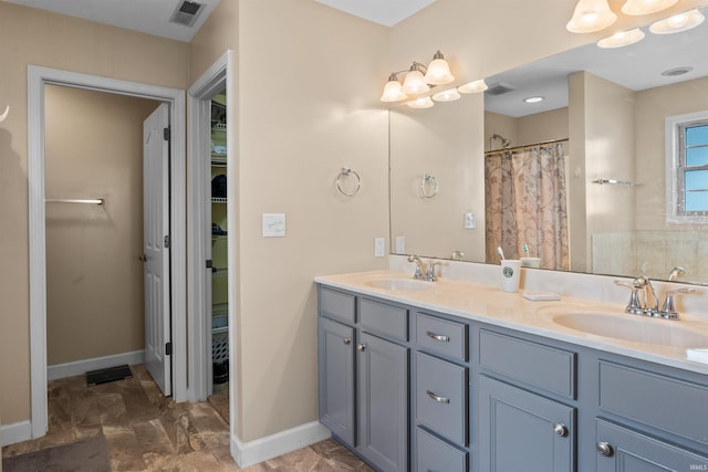 378 Buchanan St, West Lafayette, IN 47906 - full bathroom featuring double vanity, a walk in closet, and a shower with shower curtain
