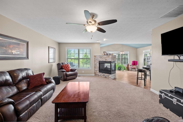 378 Buchanan St, West Lafayette, IN 47906 - living area with carpet, ceiling fan, a fireplace, and a textured ceiling