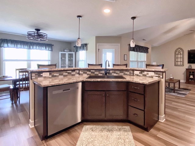 3065 E Butler Ct, Columbia City, IN 46725 - kitchen featuring dishwasher, healthy amount of natural light, light wood-style flooring, hanging light fixtures, and vaulted ceiling