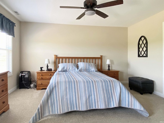 3065 E Butler Ct, Columbia City, IN 46725 - carpeted bedroom featuring baseboards and a ceiling fan