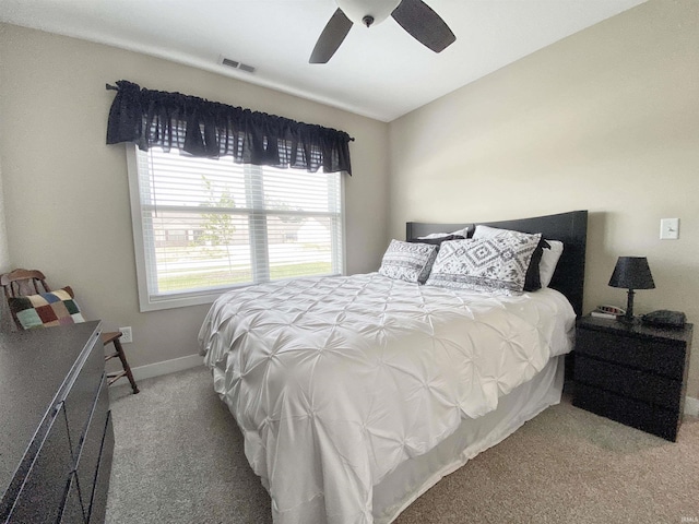 3065 E Butler Ct, Columbia City, IN 46725 - carpeted bedroom with a ceiling fan and baseboards