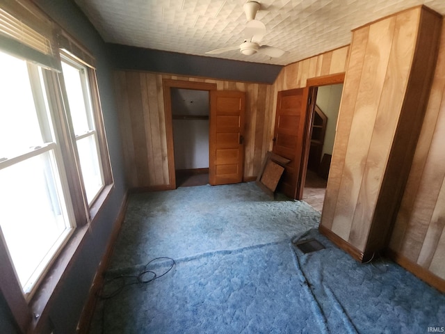 1110 Cummings St, Logansport, IN 46947 - unfurnished room featuring wooden walls and carpet