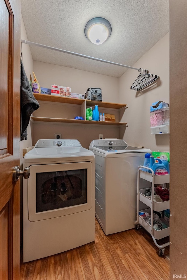 12 Chrysler Ave, Wabash, IN 46992 - washroom with separate washer and dryer, wood finished floors, and a textured ceiling